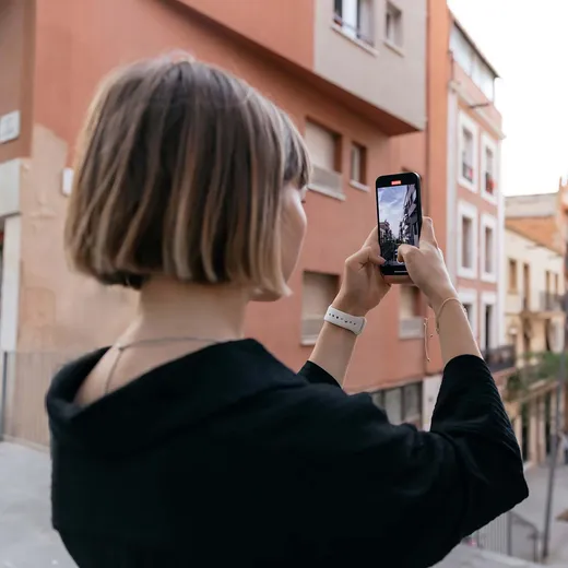 A citizen accessing services on a smartphone in the city