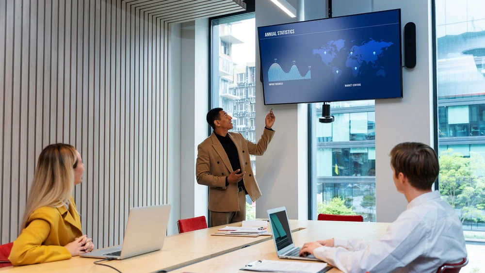 Business colleagues reviewing geospatial dashboards