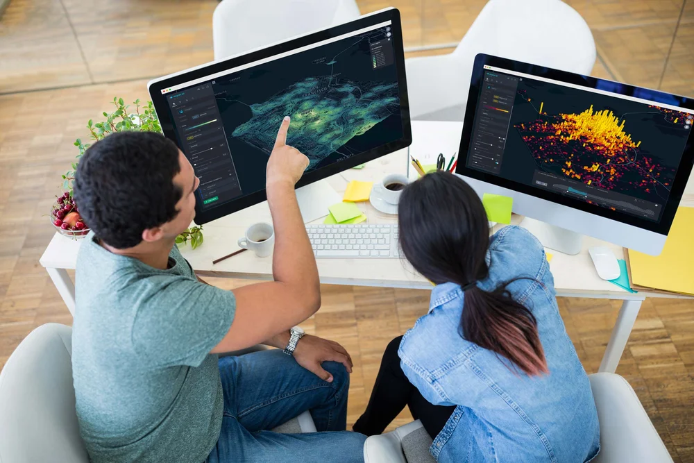 Graphic designers collaborating at a computer