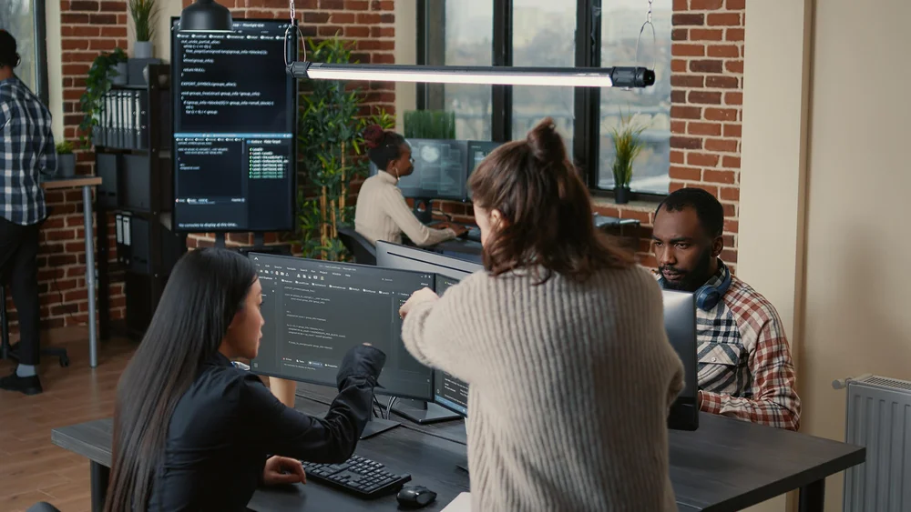 A team collaborating on geospatial training